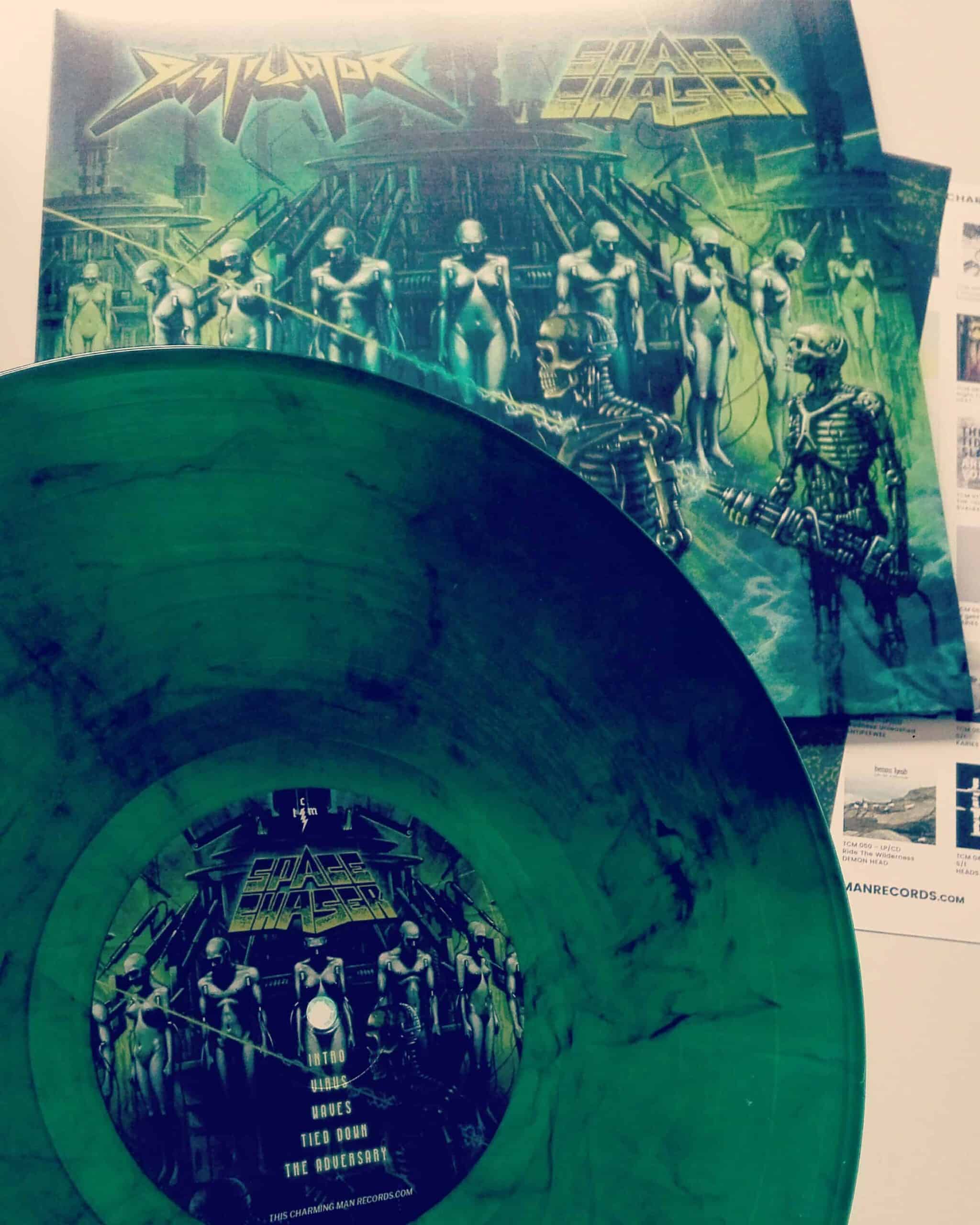 Space Chaser/Distillator - Split LP/CD Pressing Info: 1st press: 150x green black marbled (mailorder exclusive), 450x black 2nd press: 500 copies clear  