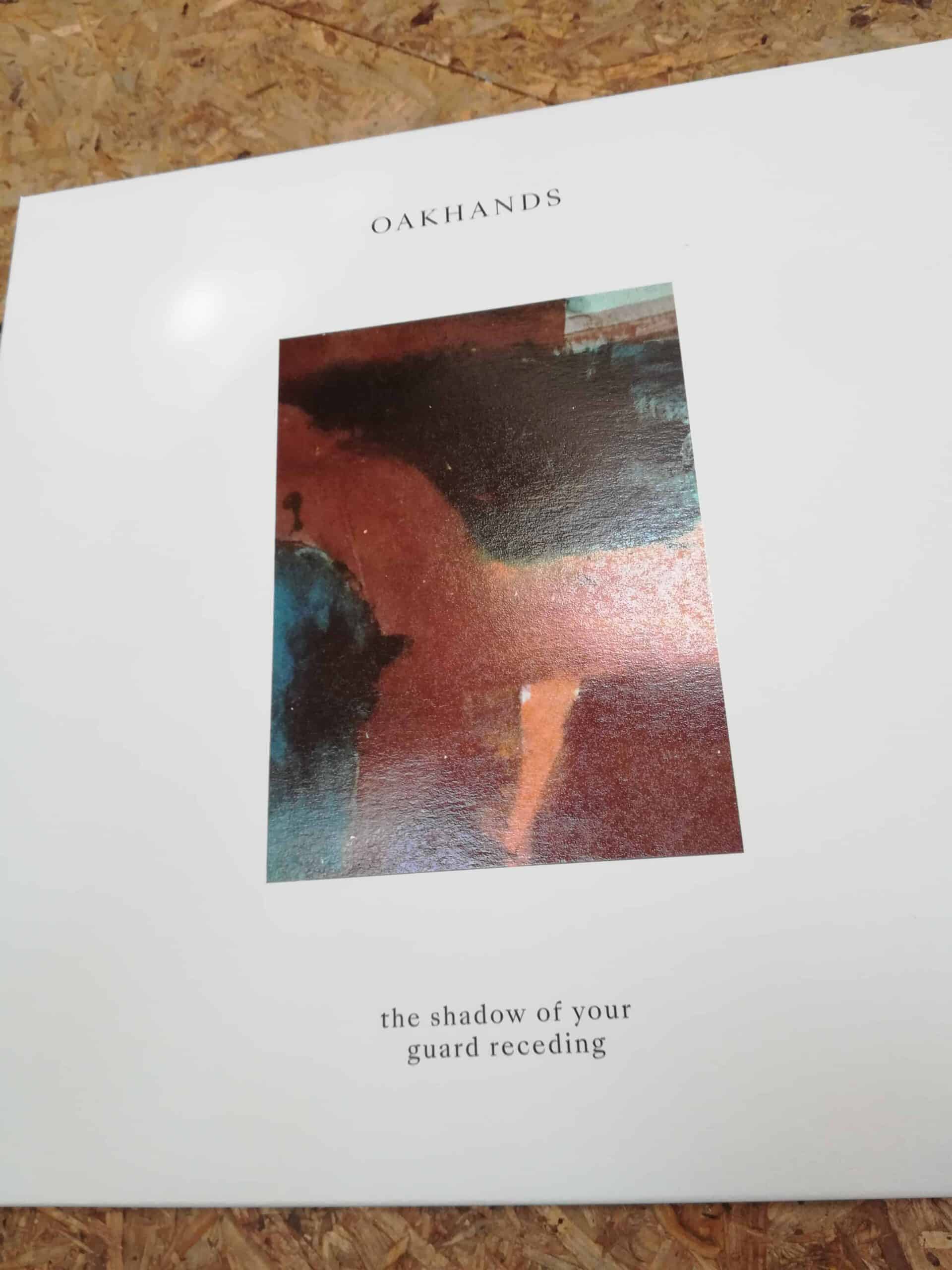 Oakhands - The Shadow of Your Guard Receding LP/CD 100 copies clear with black & oxblood splatter Wax, 400 copies white all Lps have a pratial UV Spot On Lacquer and come with a 24 sided full colour Booklet!