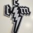 This Charming Man shaped embroided Logo PATCH - silver Colour: silver