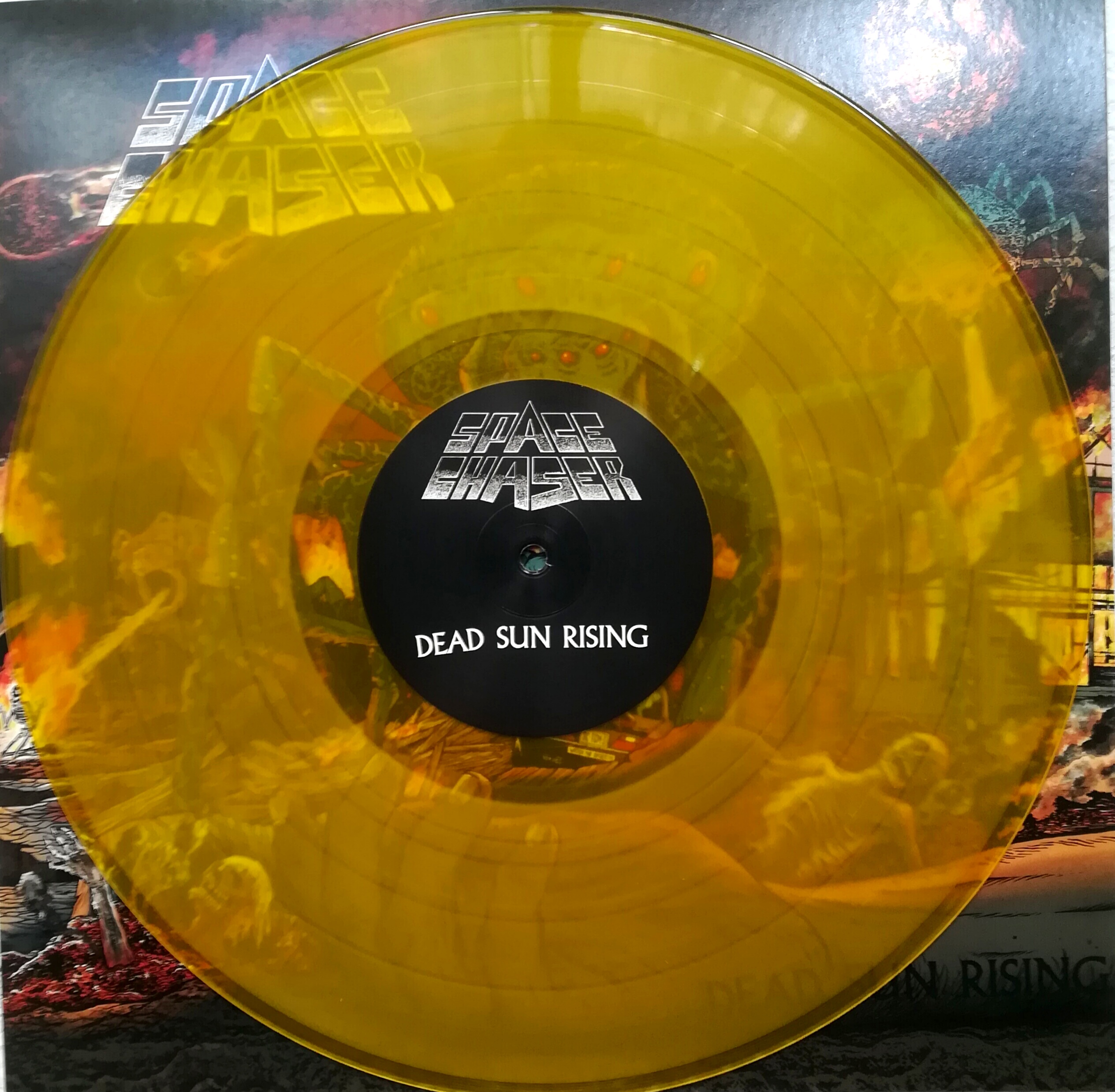 Space Chaser - Dead Sun Rising col.LP/CD Pressing Info: 1st press: 150x blood red, 600x black (Sold Out) 2nd press: 500x clear brown marbled (Sold Out) 3rd press: 150x solid orange marbled & 150x transparent yellow vinyl comes with downloadcode, CD version in jewelcase