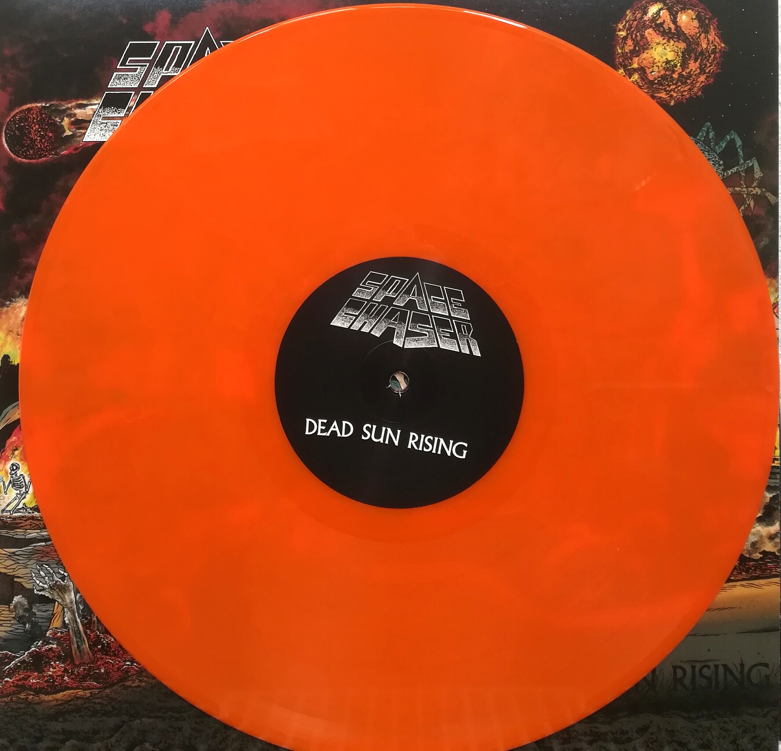 Space Chaser - Dead Sun Rising col.LP/CD Pressing Info: 1st press: 150x blood red, 600x black (Sold Out) 2nd press: 500x clear brown marbled (Sold Out) 3rd press: 150x solid orange marbled & 150x transparent yellow vinyl comes with downloadcode, CD version in jewelcase